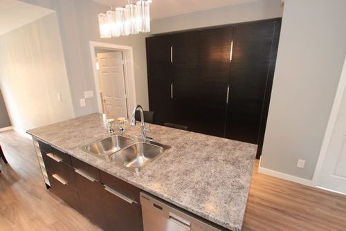 A marble countertop with an aluminum kitchen sink for a kitchen renovation project
