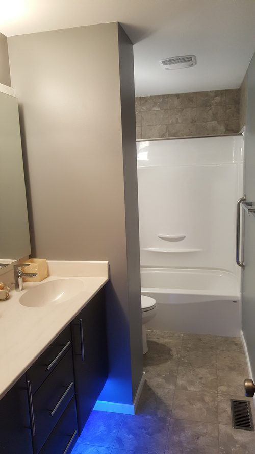 An illuminated kitchen sink and several other improvements for a bathroom renovation project