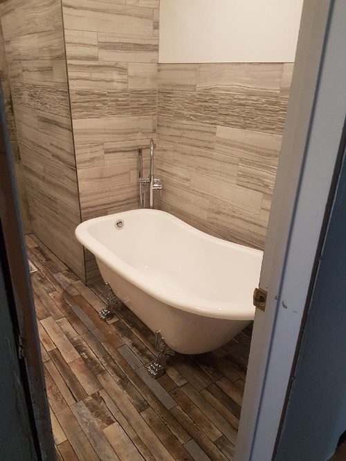Wood flooring and a faux-wood wall for a bathroom renovation project