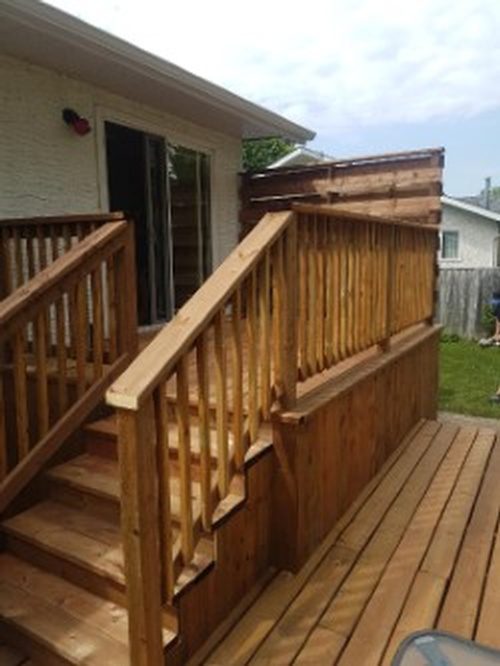A backyard wooden deck addition