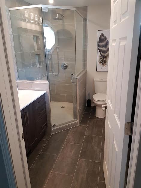 Stone flooring and a new shower area for a bathroom renovation project