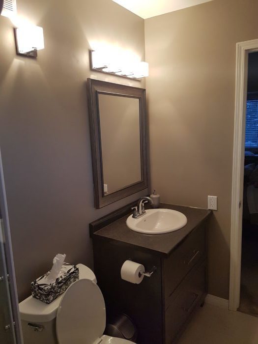 Modern brown drawers with a mirror to match for a bathroom renovation project