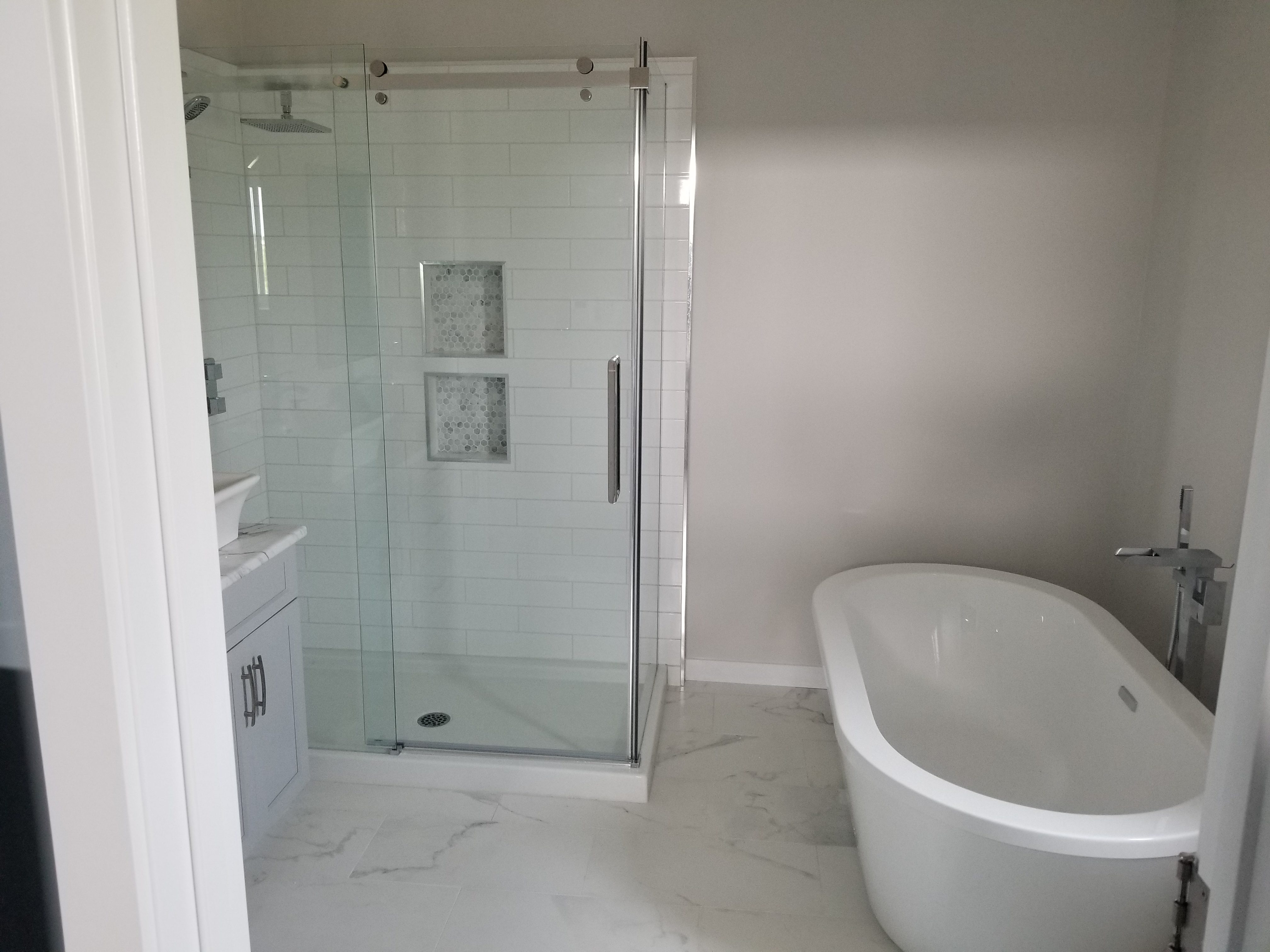 Marble flooring and a new shower area for a bathroom renovation project