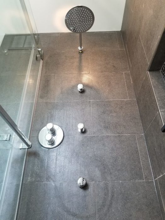 Modern showerheads for a new shower area in a bathroom renovation project