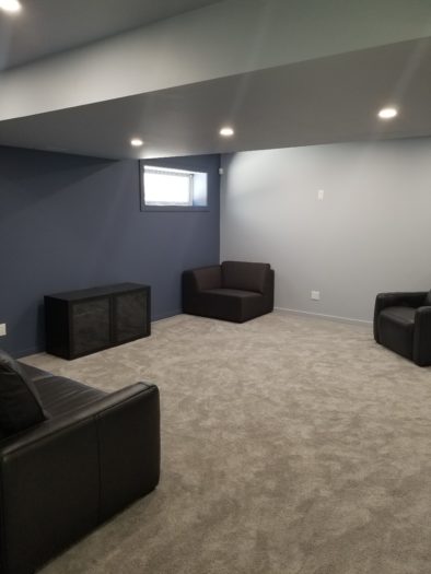 Living room area of a basement renovation project