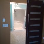 Adding a sliding door for a bathroom renovation project - Bathroom Renovations Winnipeg - Dash Builders