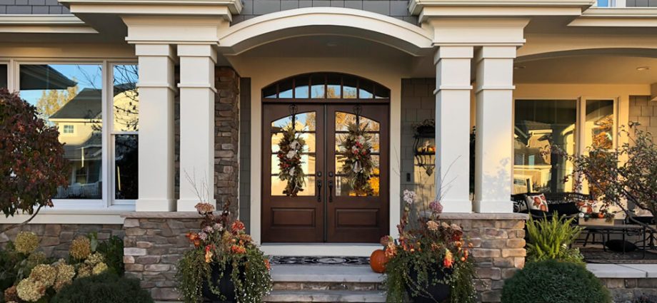 grand front entrance of home with columns outdoor seating area